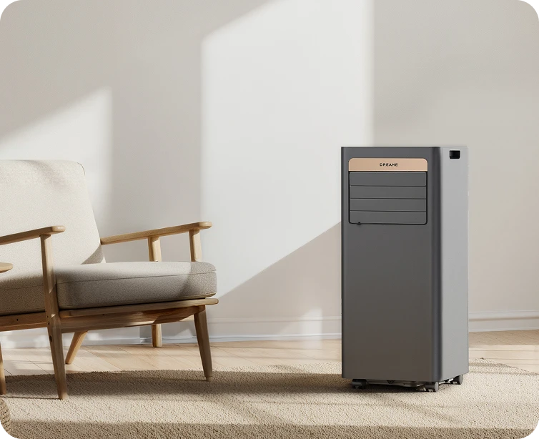Dreame Climatiseur portable P-Wind10 9 000 BTU au design compact – gain de place idéal pour les petits espaces, posé à côté d'un fauteuil